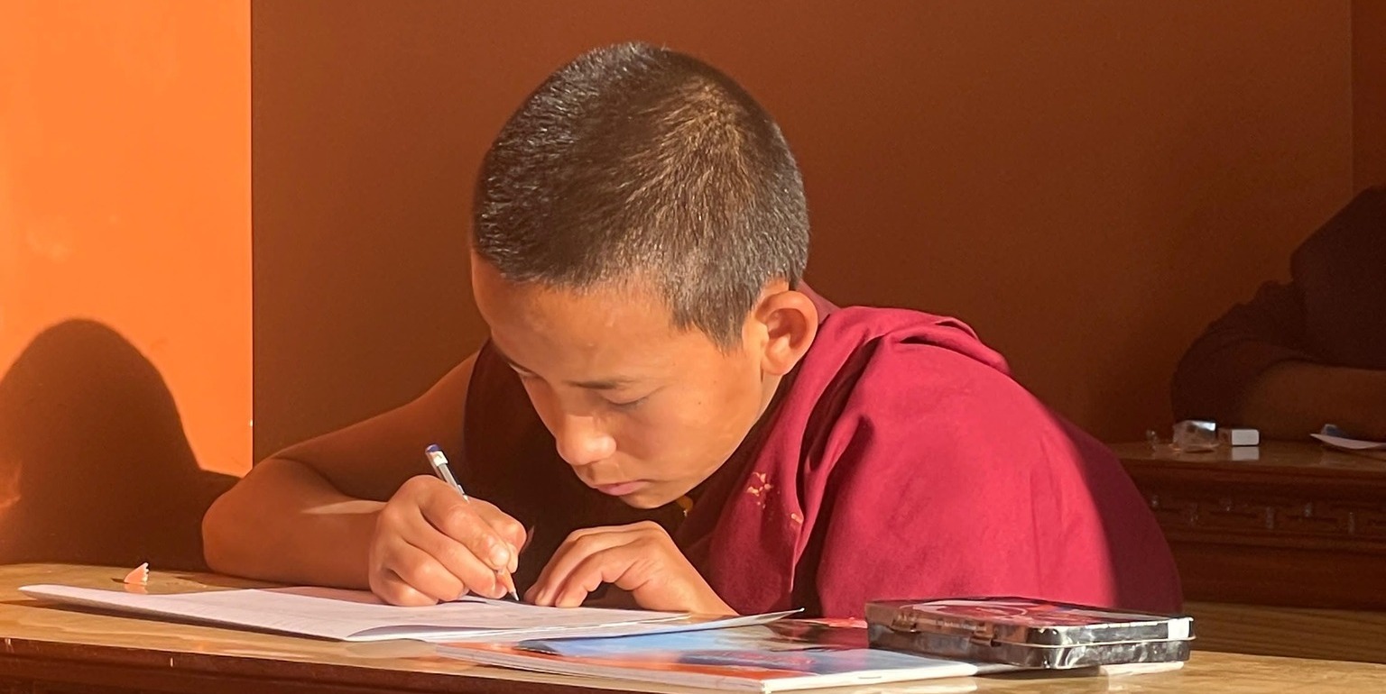 2025_04_REPAS_monk_writing-e1757506196457-1536x1174